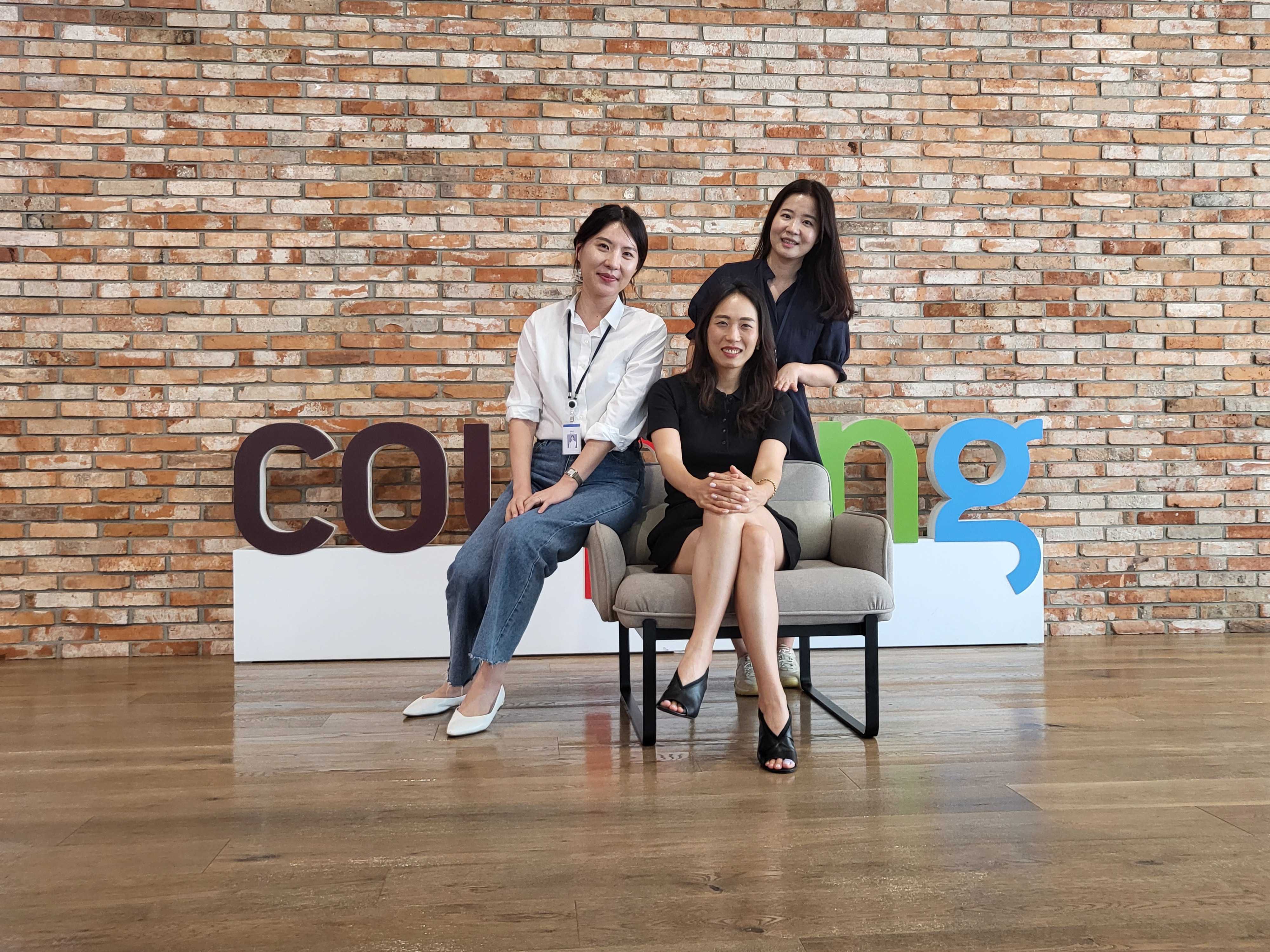 a group of women posing for a picture