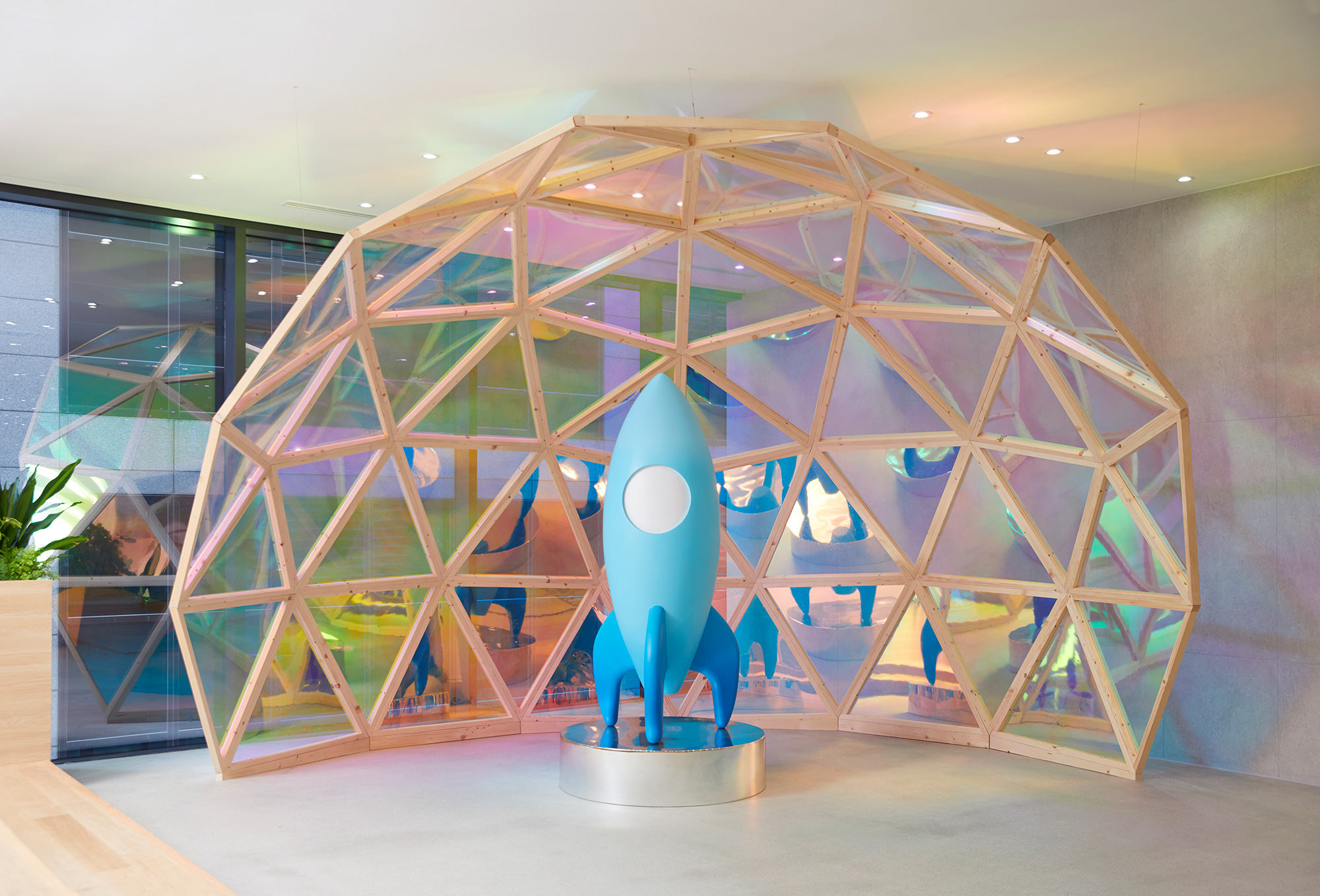 a blue rocket in a dome shaped structure