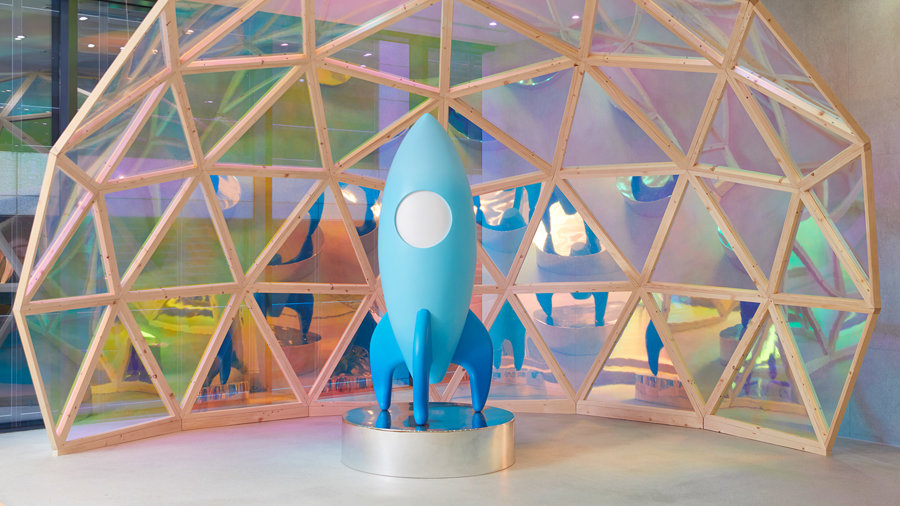 a blue rocket in a dome shaped structure