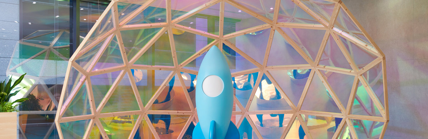 a blue rocket in a dome shaped structure