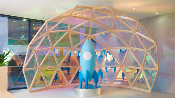 a blue rocket in a dome shaped structure
