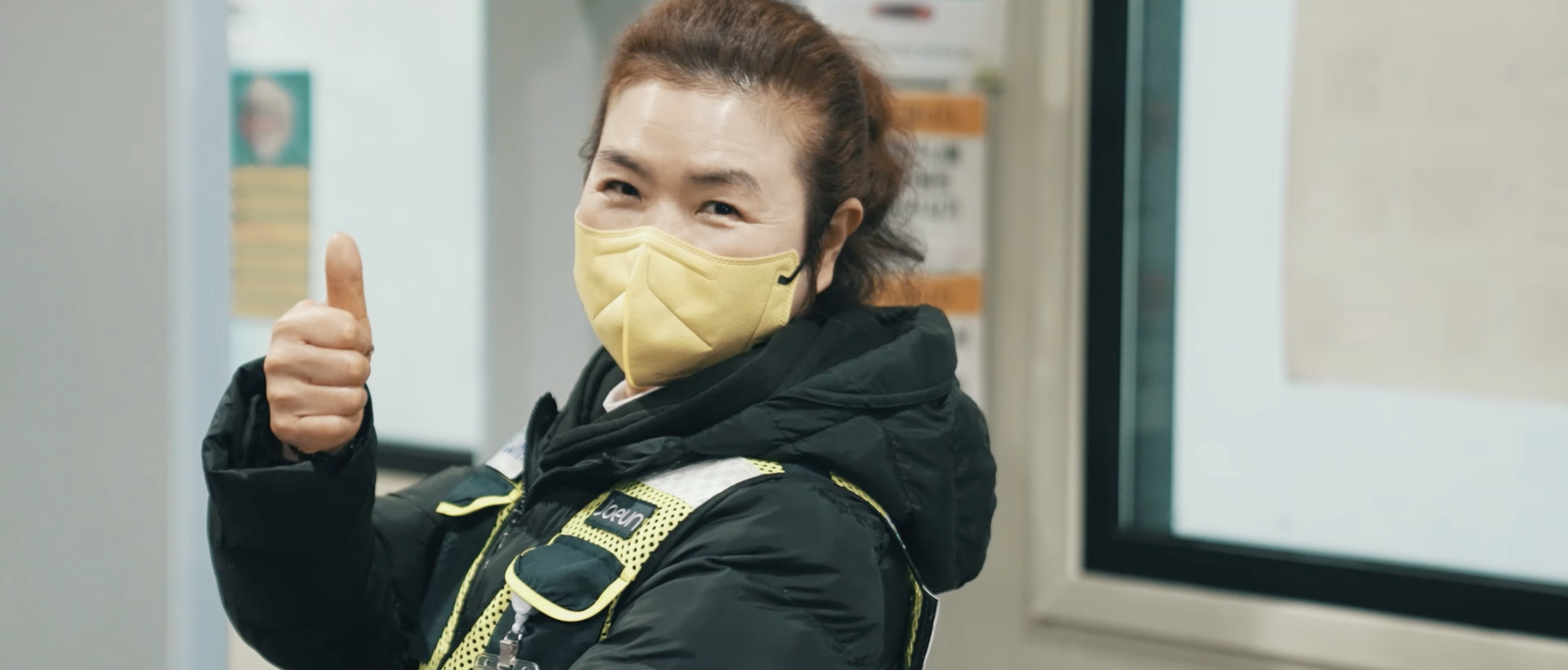 a person wearing a yellow face mask