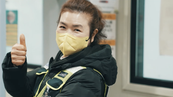 a person wearing a yellow face mask