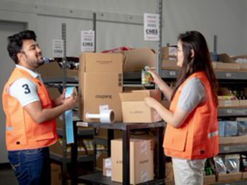 a person and person in a warehouse