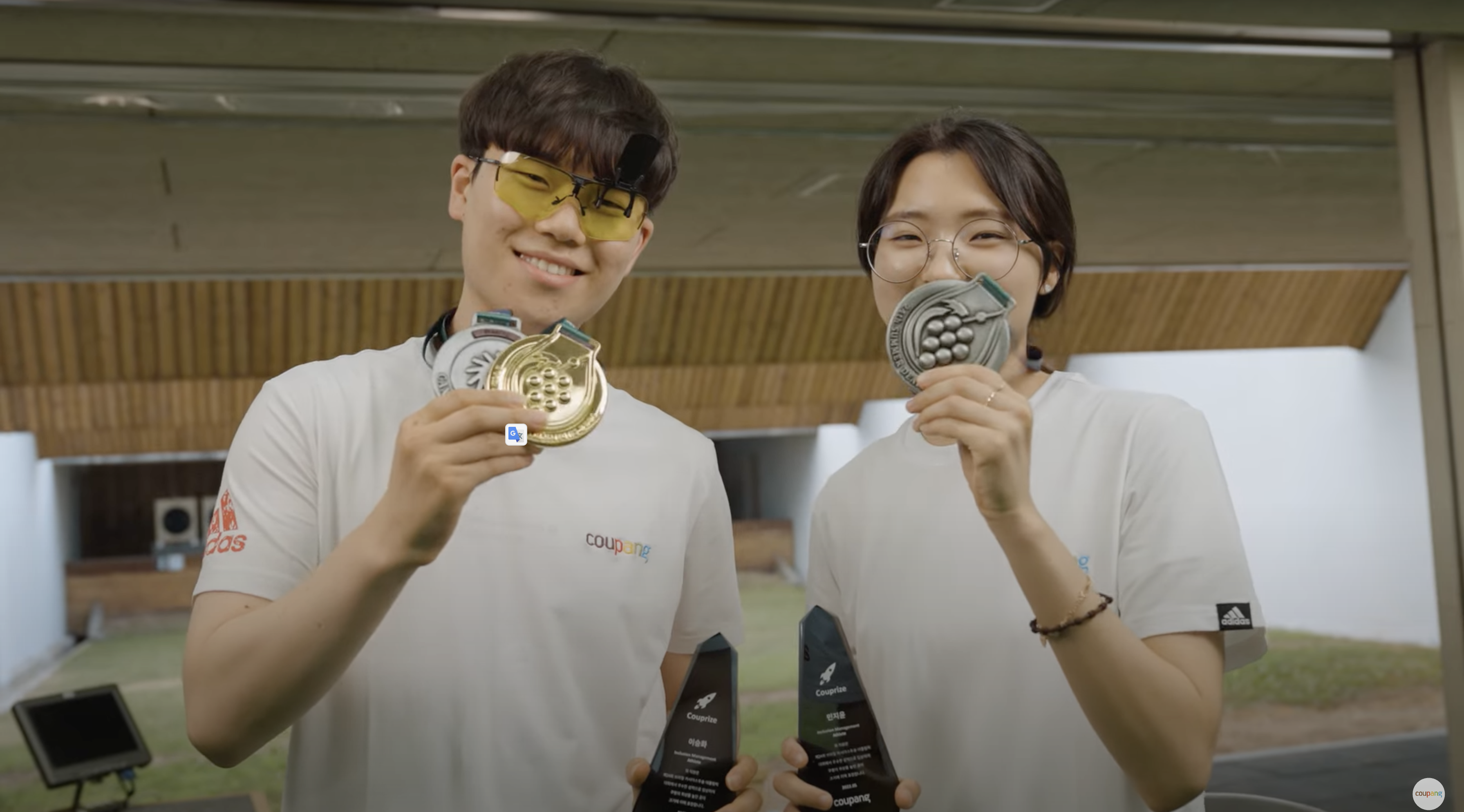 a couple of people holding trophies