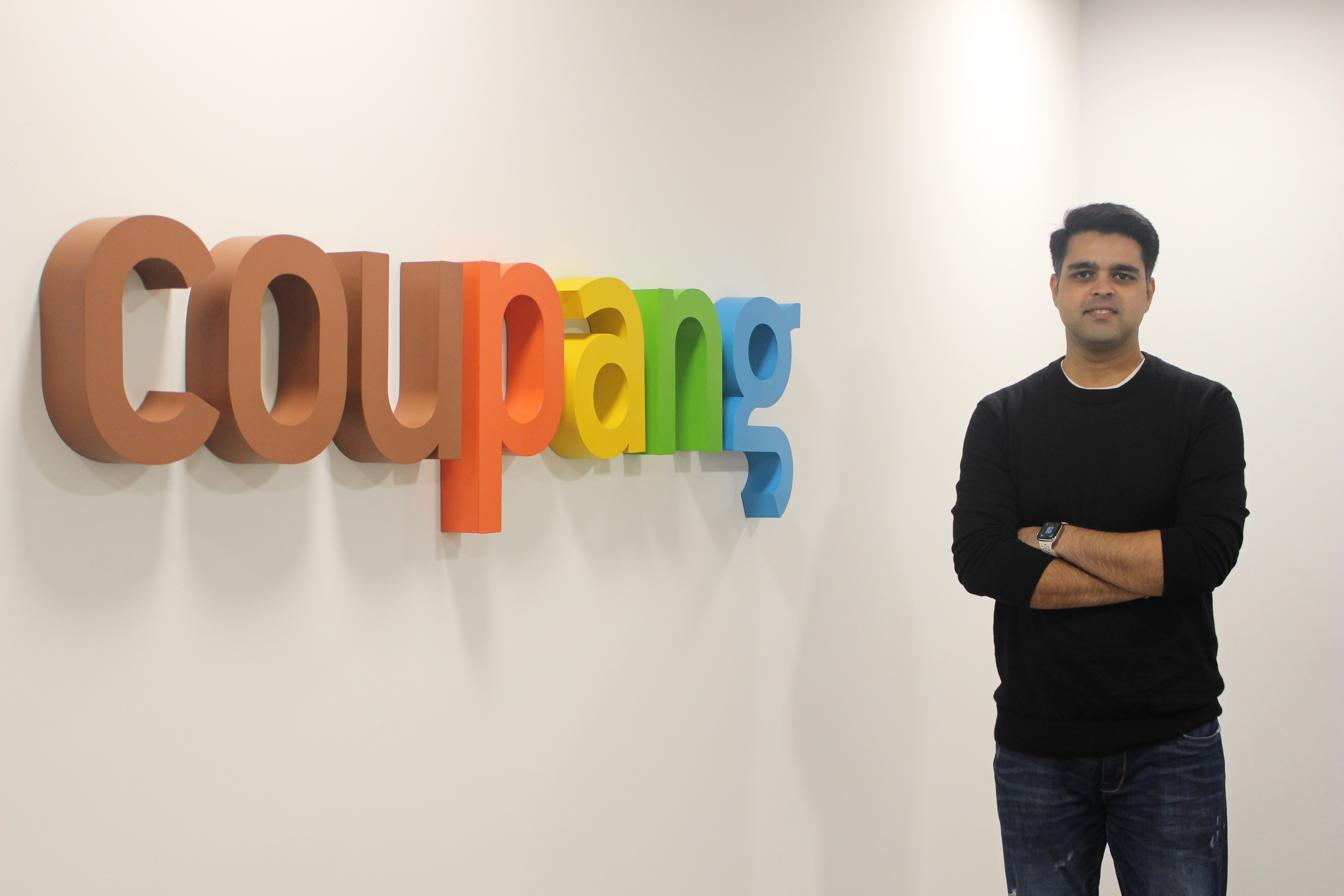 a person standing in front of a sign