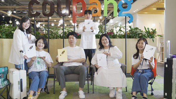 a group of people posing for a photo