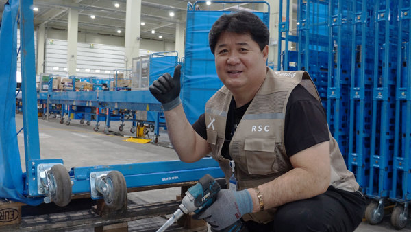a person holding a drill