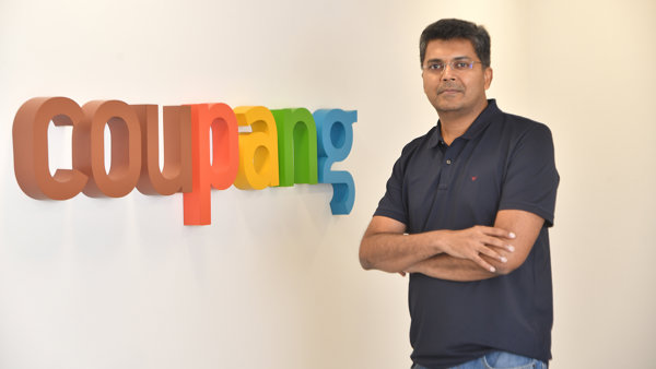 a person standing in front of a sign