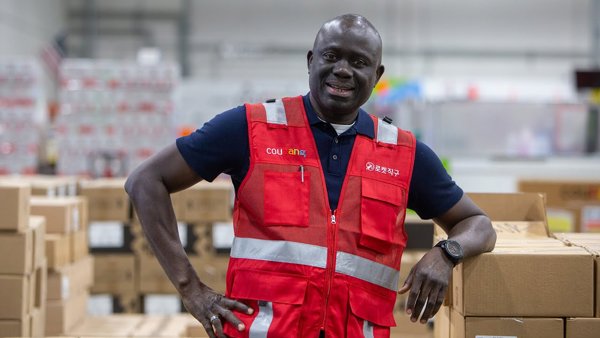 a person in a red vest