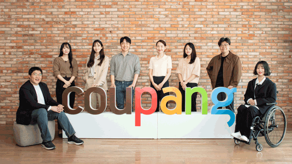 a group of people posing for a photo