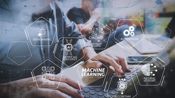 a group of people using a computer