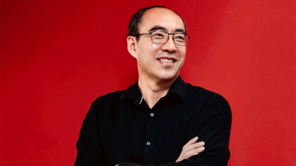 a person in black shirt with arms crossed