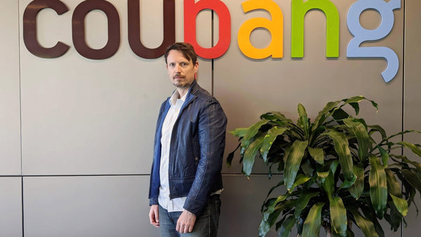 a person standing in front of a sign