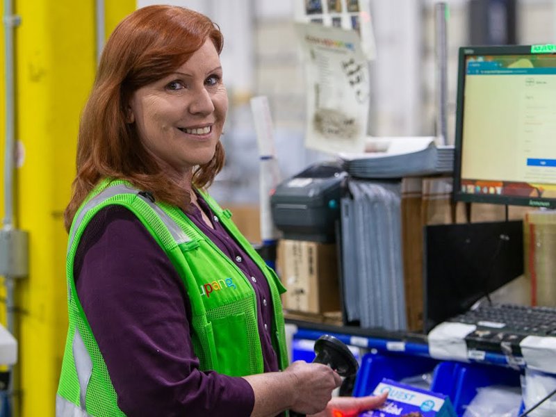a person in a green vest