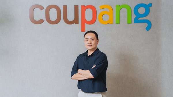 a person standing in front of a sign