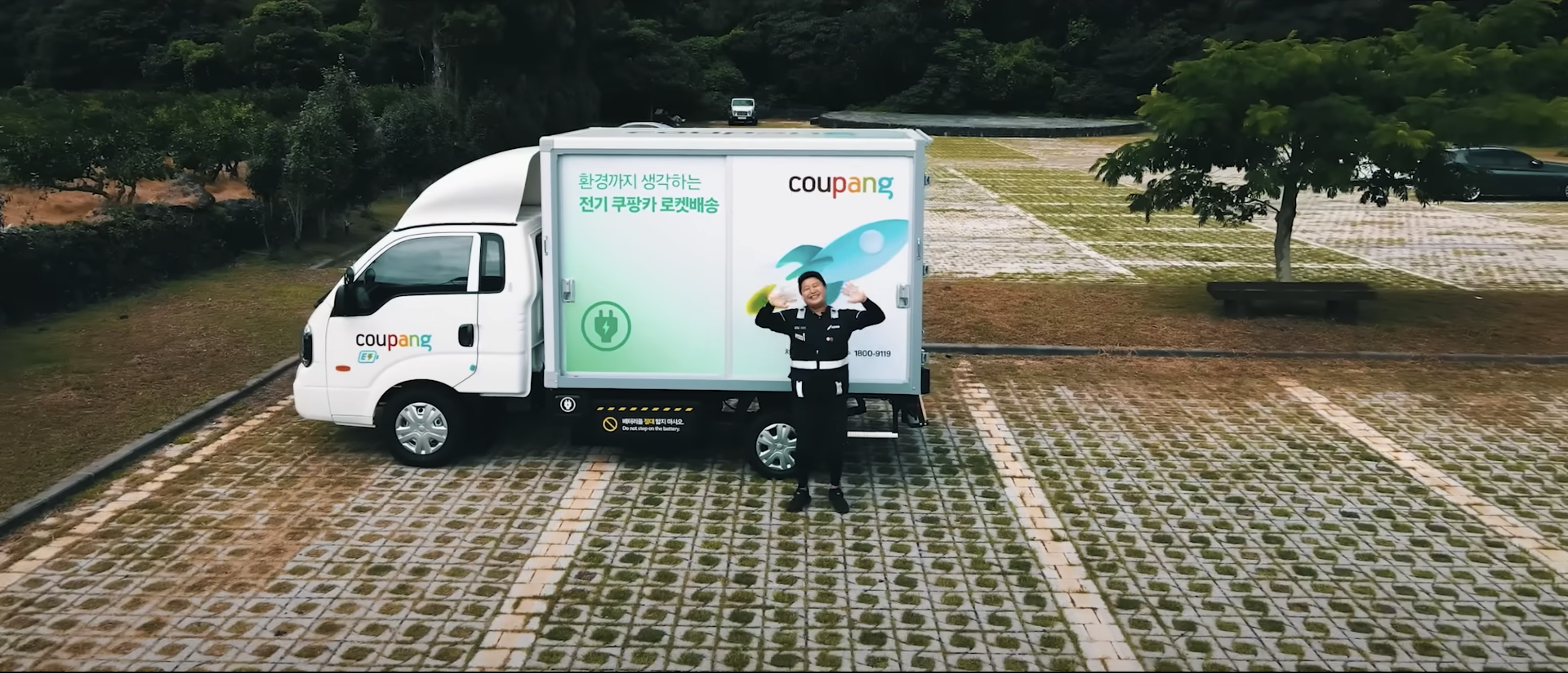 a person standing in front of a truck