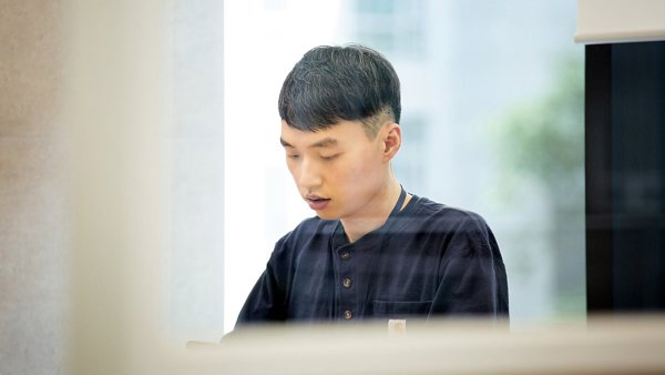 a person sitting down looking down