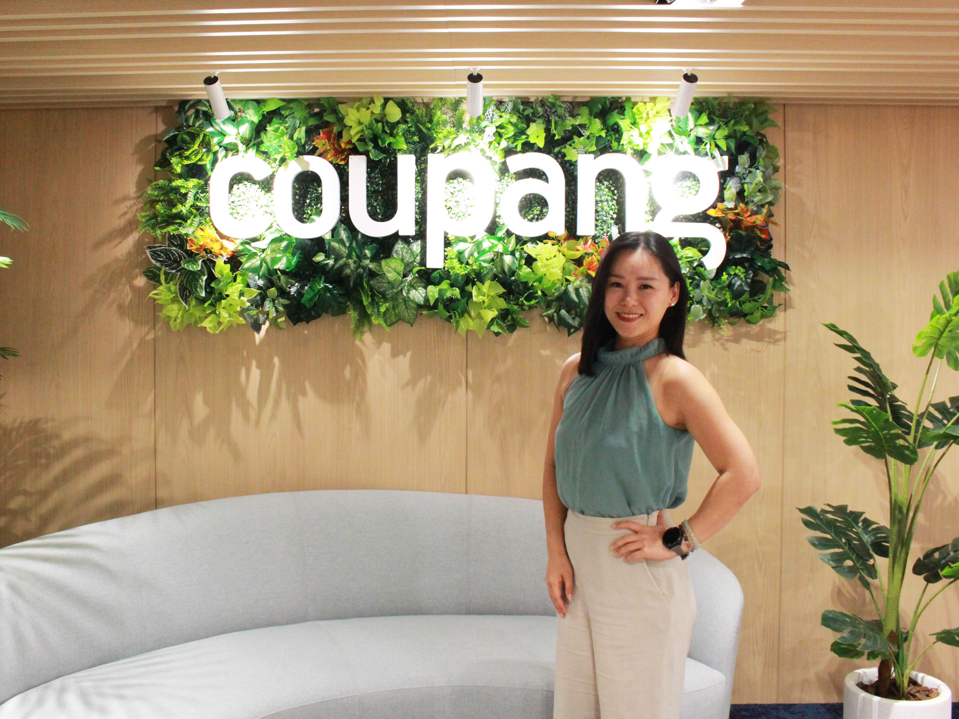 a person standing in front of a sign