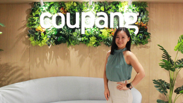 a person standing in front of a sign