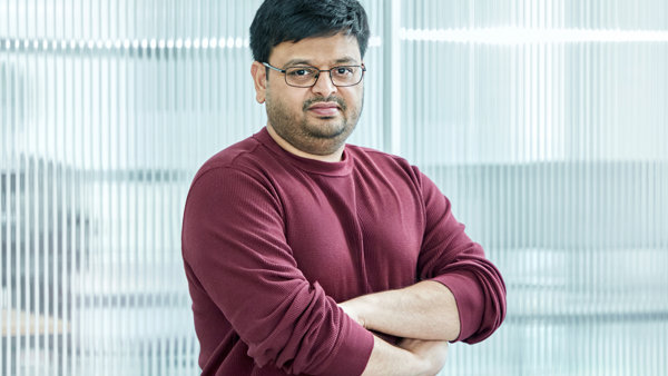 a person with glasses and a red shirt