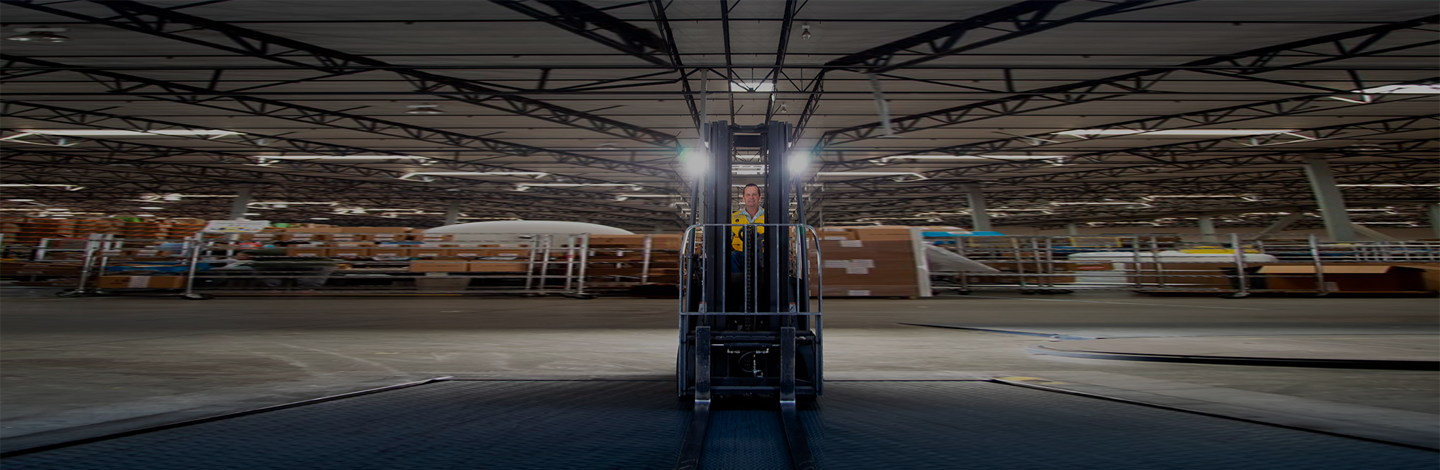 a person standing in a forklift