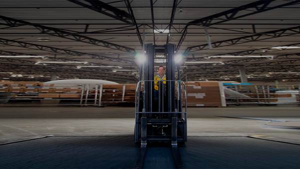 a person standing in a forklift