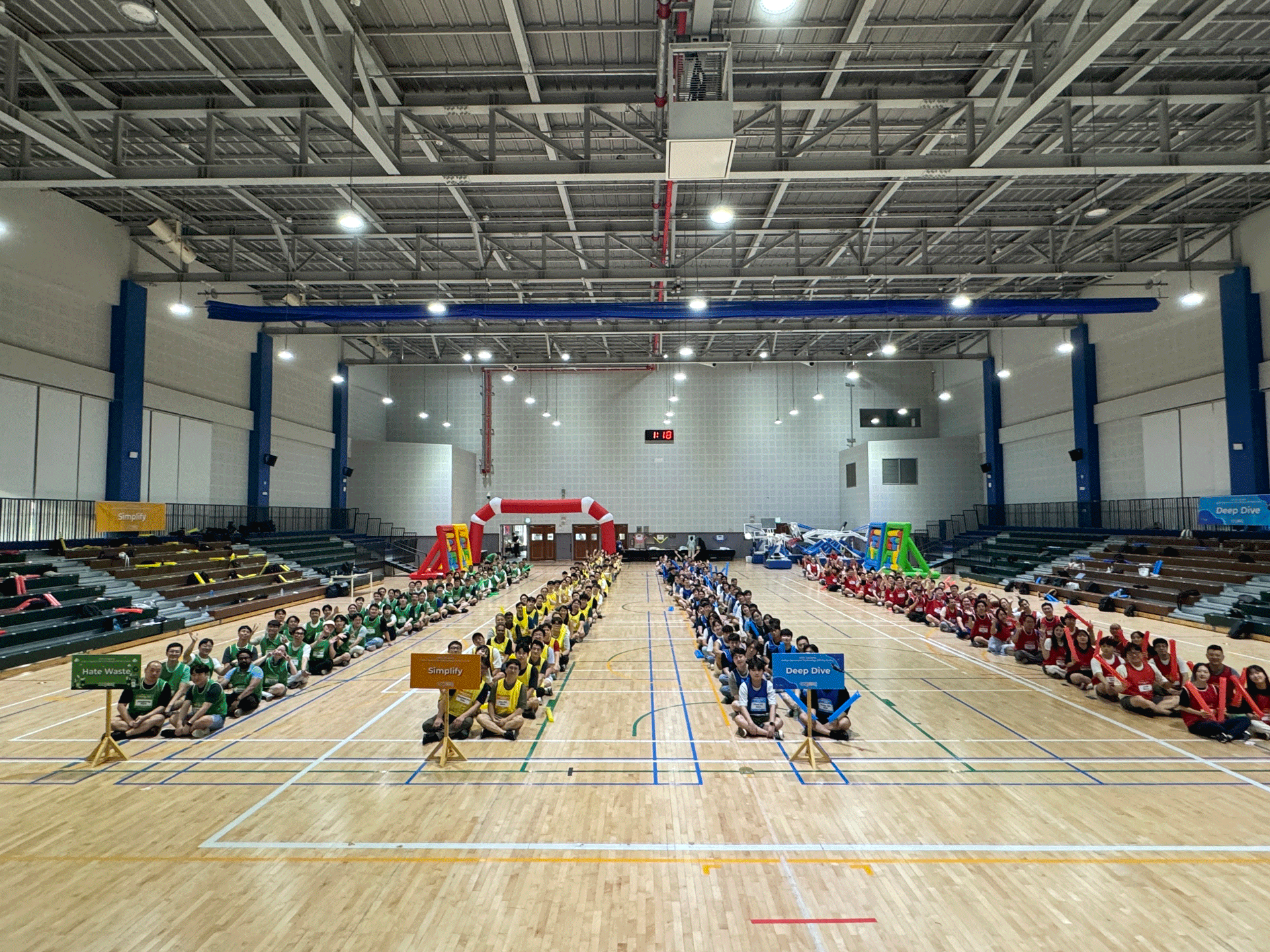 a group of people sitting on a court