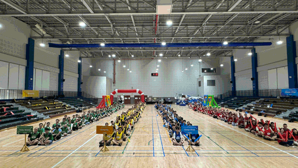 a group of people sitting on a court