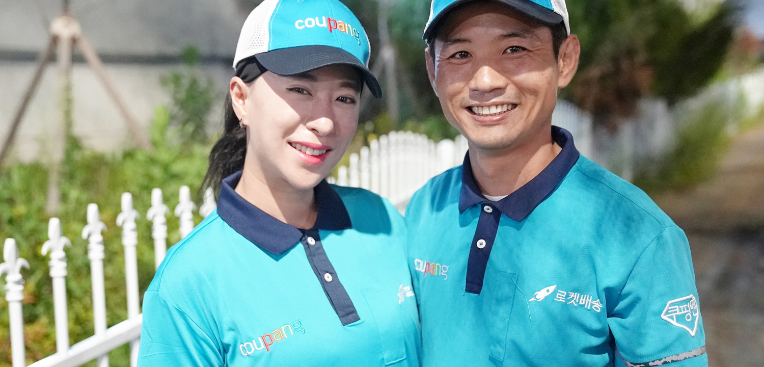 a person and person wearing matching blue shirts and hats