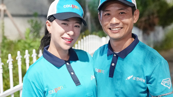 a person and person wearing matching blue shirts and hats