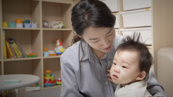 a person holding a baby