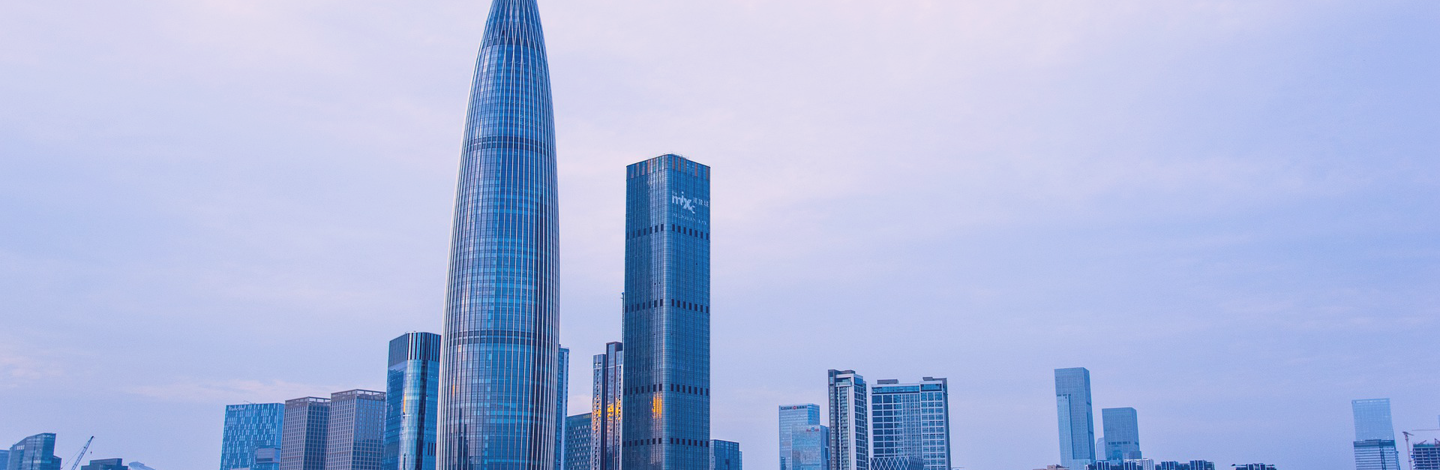 a city skyline with tall buildings and water