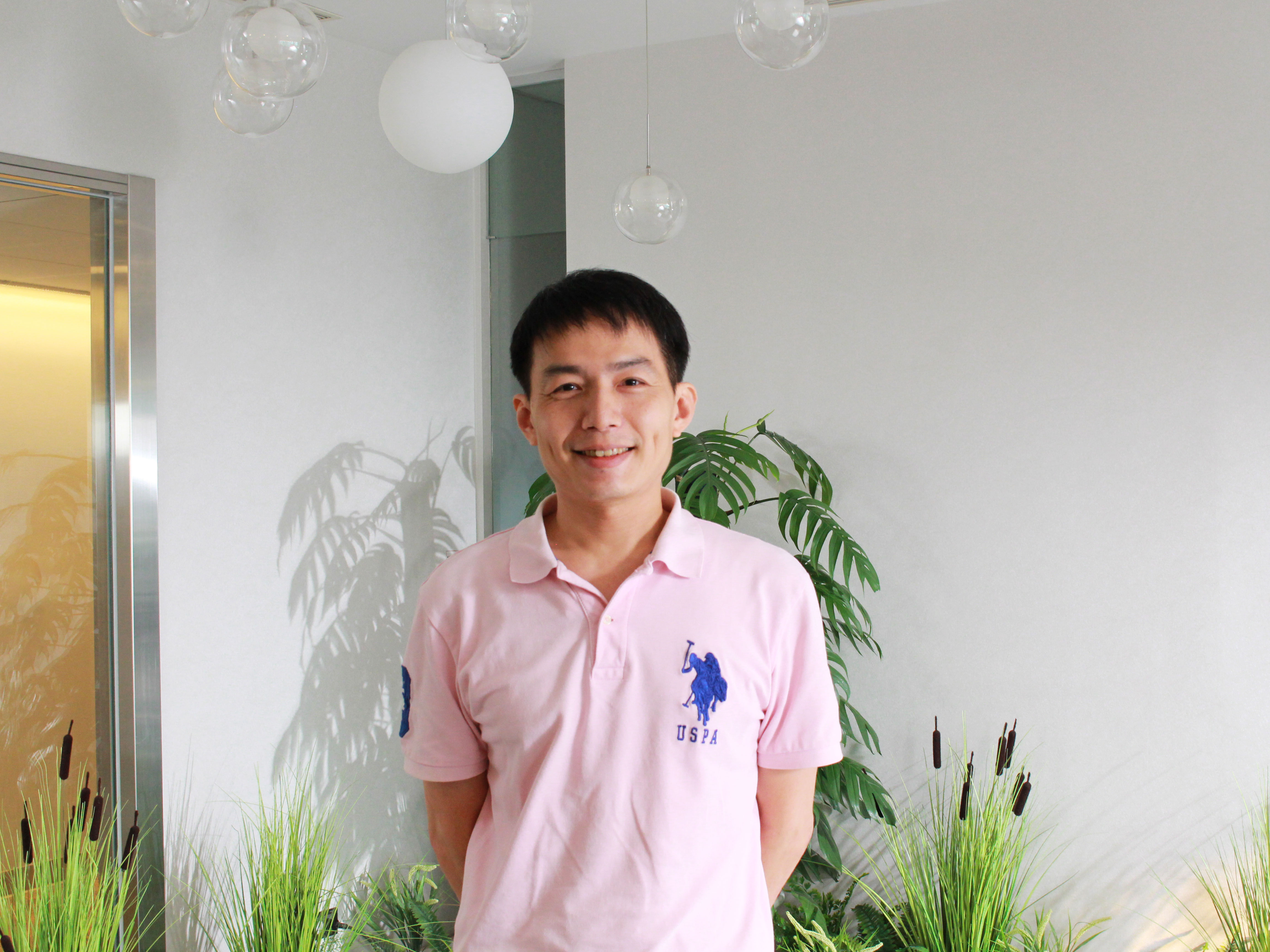 a person standing in front of plants