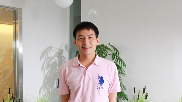 a person standing in front of plants