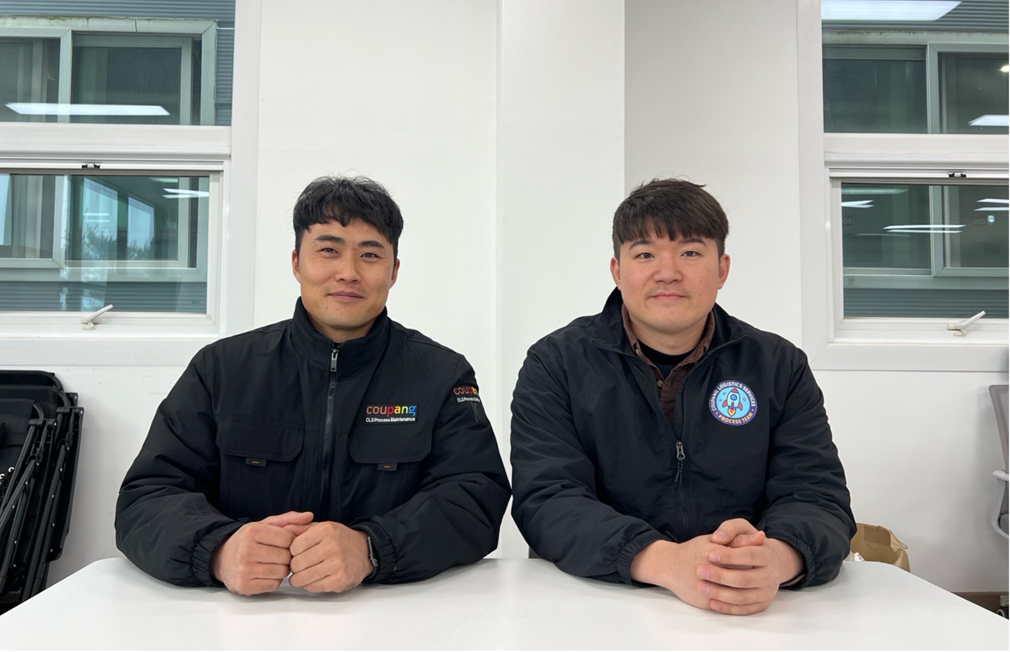 two men sitting at a table