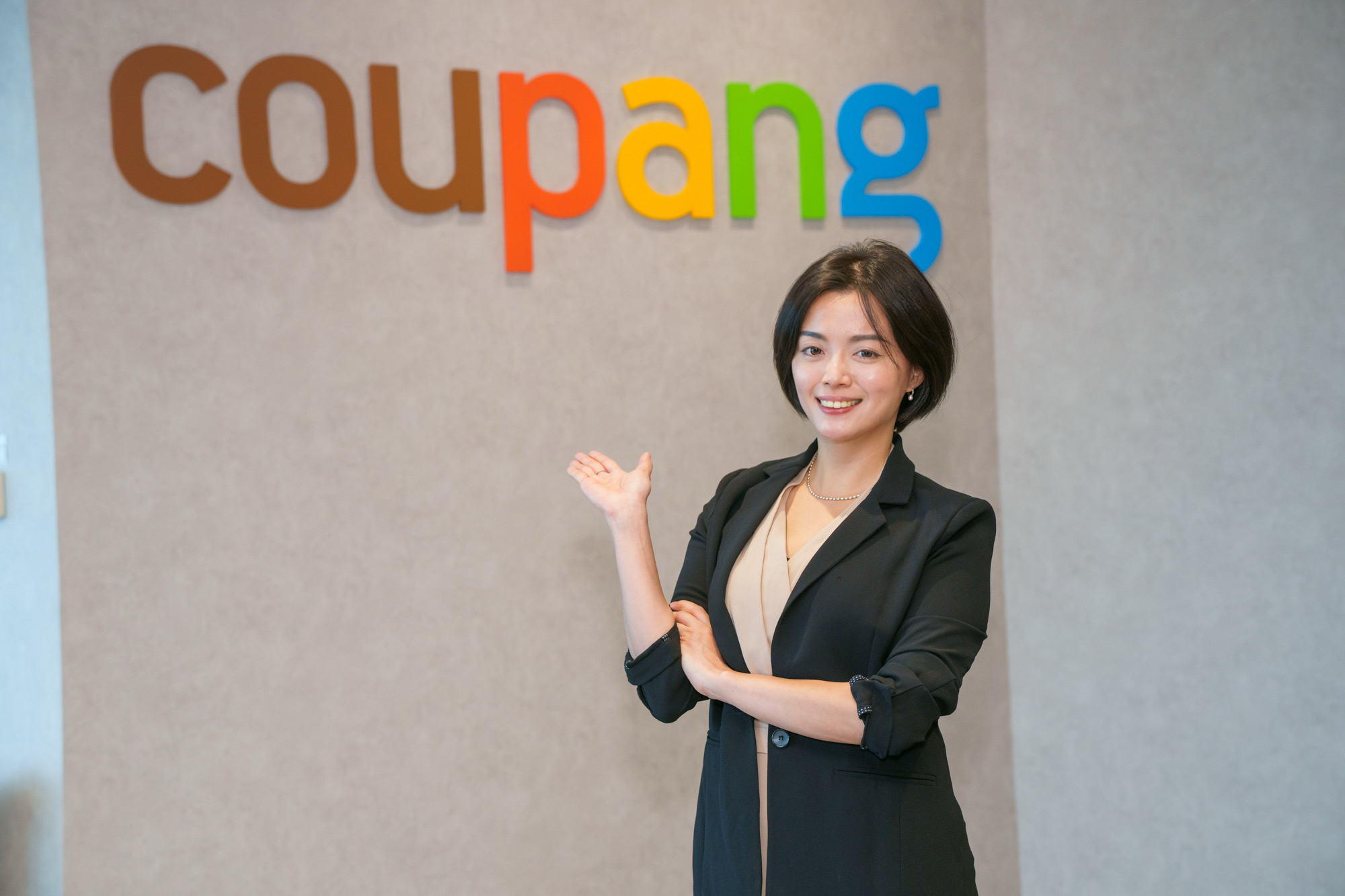 a person standing in front of a sign