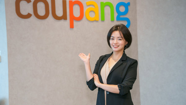 a person standing in front of a sign