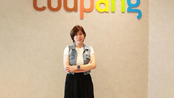 a person standing in front of a sign