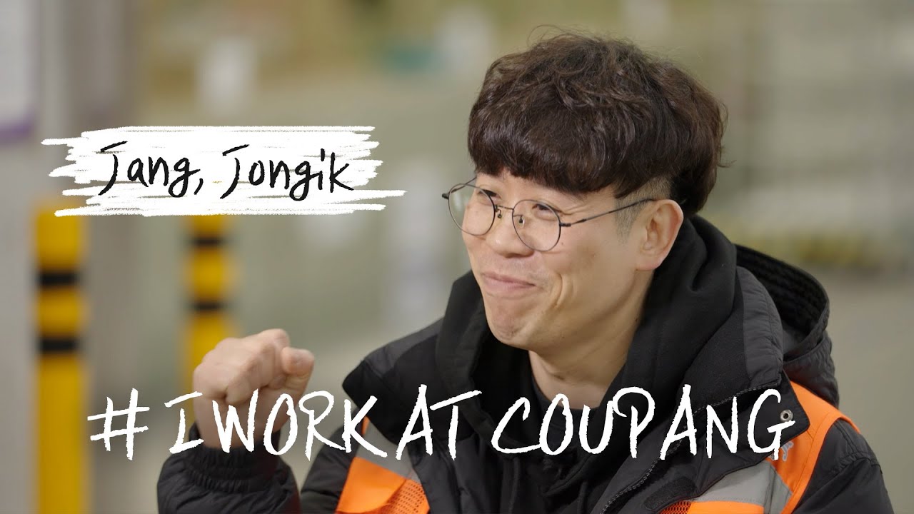 a person wearing glasses and a black jacket