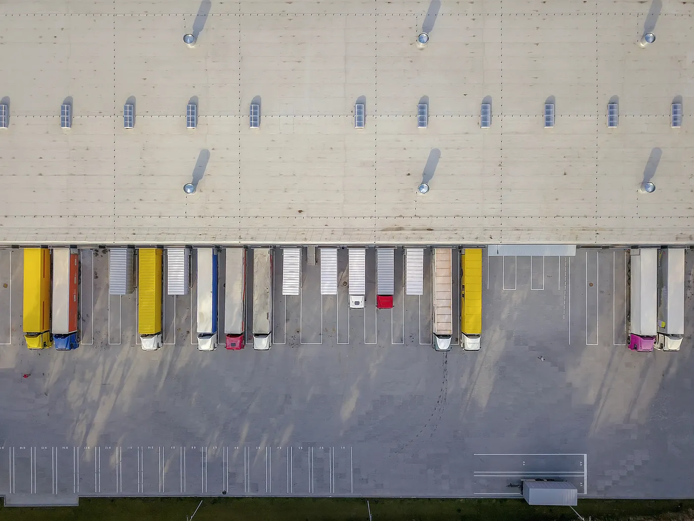 a aerial view of a parking lot with trucks