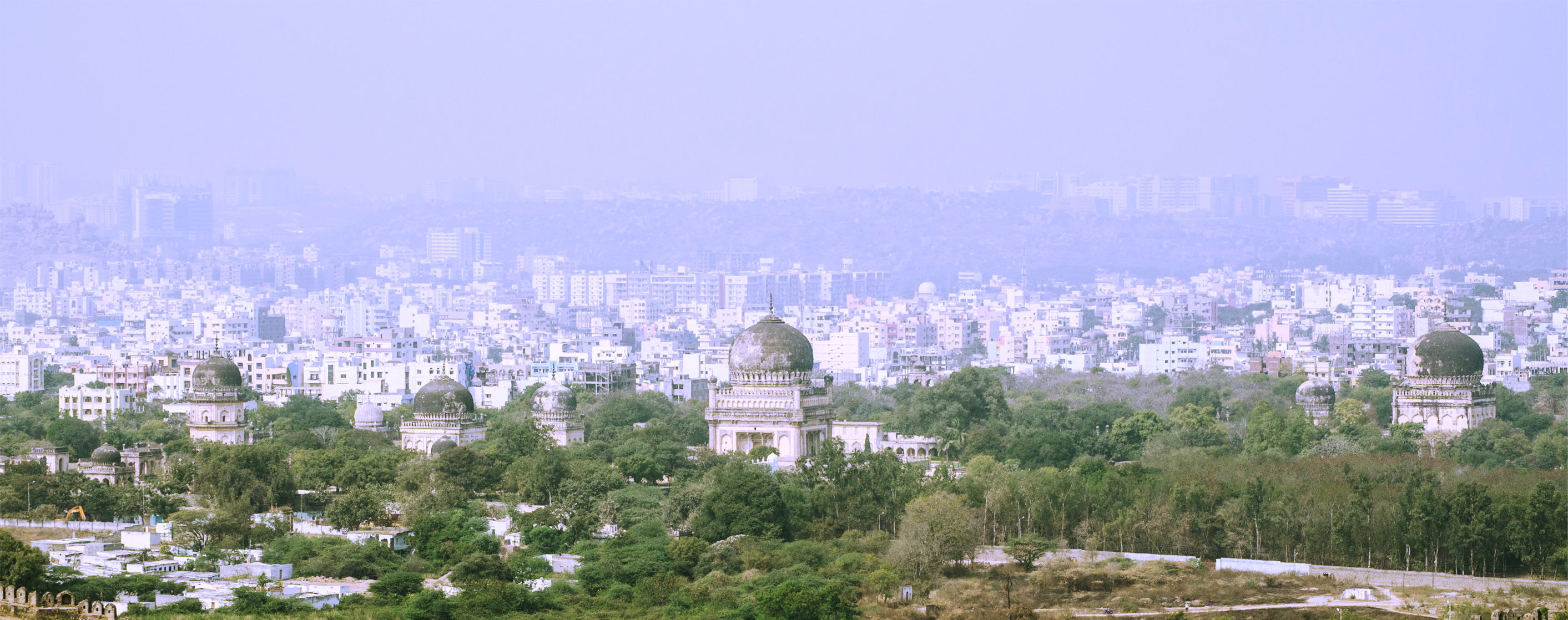 a building with a dome in the middle of a city