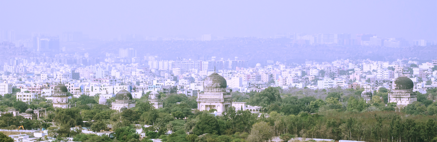 a building with a dome in the middle of a city